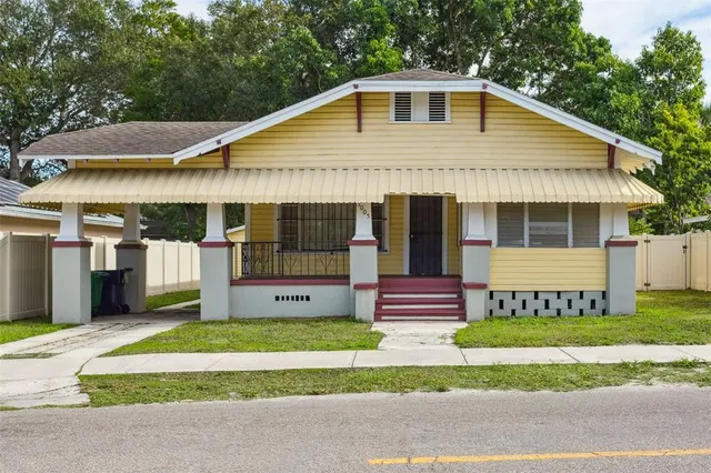 a front view of a house with a yard and porch