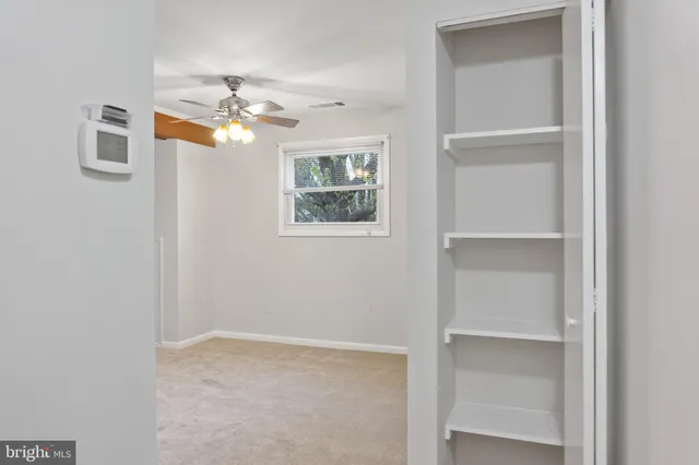 a view of a kitchen from the hallway