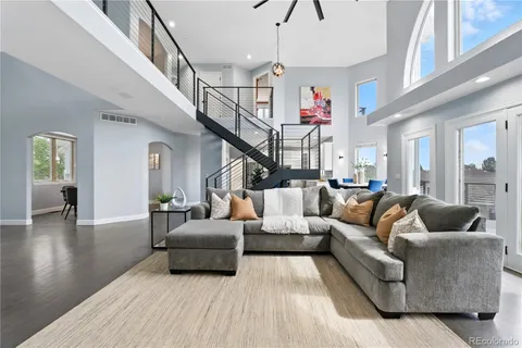 a living room with furniture or wooden floor and a chandelier