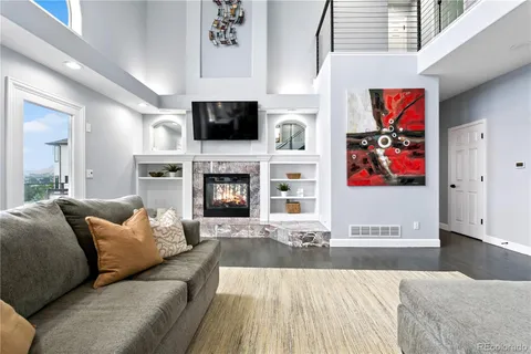 a living room with furniture fireplace and flat screen tv