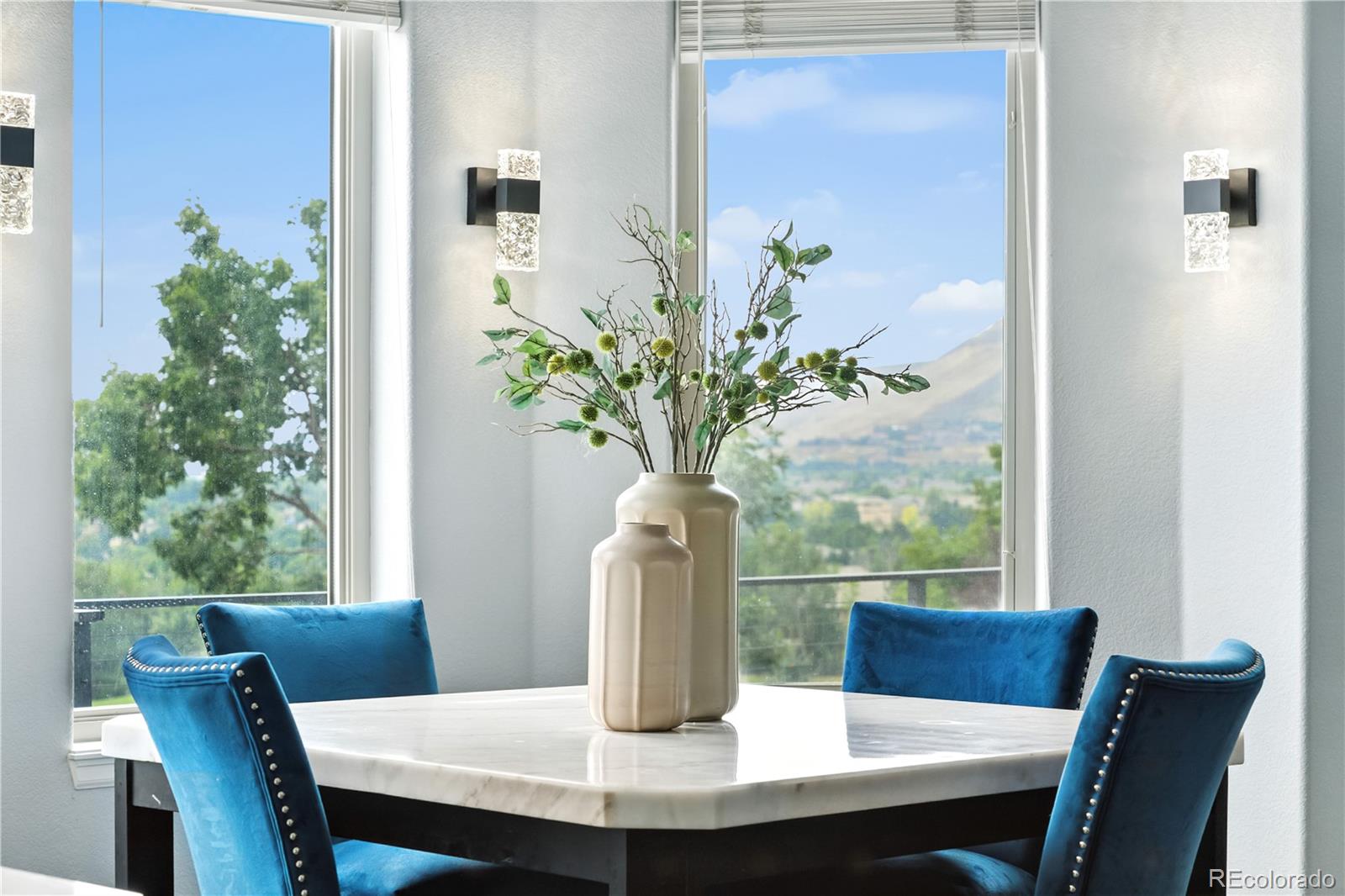 7092 Secrest Court Arvada, CO 80007 - Photo 17 of 49 a view of a dining room with furniture window and wooden floor