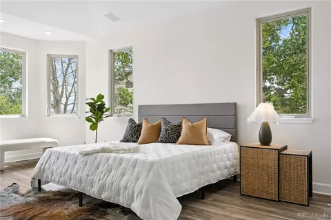 a bedroom with bed and a window