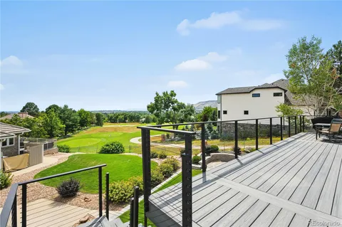 a view of a balcony with wooden floor