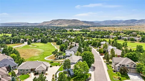 an aerial view of residential houses with outdoor space and street view