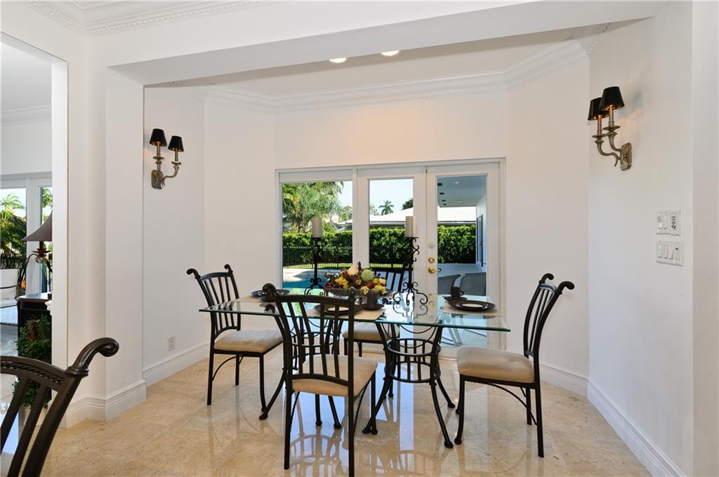 2 Compass Lane Fort Lauderdale, FL 33308 - Photo 17 of 43 a view of a dining room with furniture window and outside view