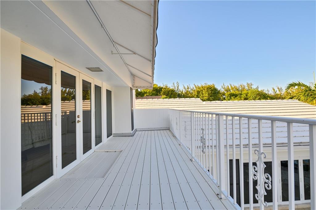 2 Compass Lane Fort Lauderdale, FL 33308 - Photo 31 of 43 a view of a balcony with wooden floor and fence