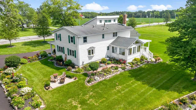 a view of a house with a yard
