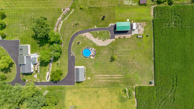 an aerial view of a house with a garden