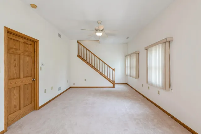 a kitchen with a refrigerator a sink and cabinets