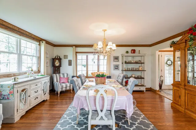 a bed room with a bed furniture and a large window