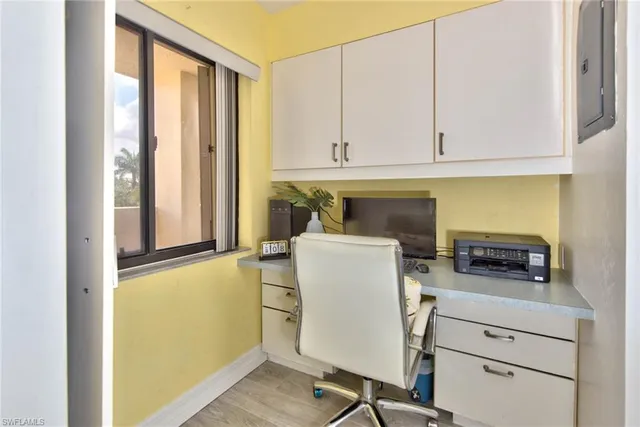 a utility room with cabinets washer and dryer