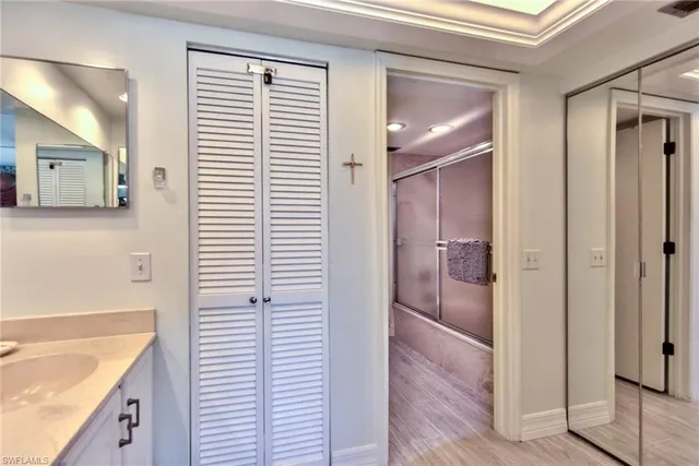 a bathroom with a bathtub and a sink