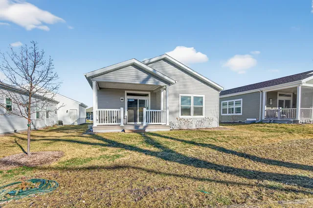 a view of a house with a backyard and balcony
