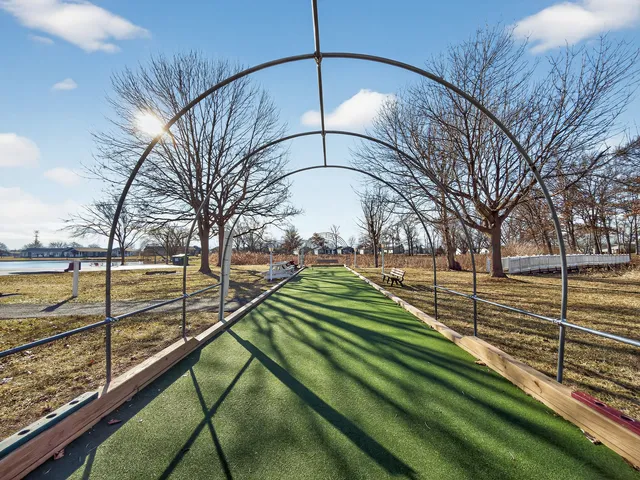 a view of a backyard with sitting area