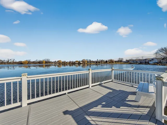 a view of a balcony with wooden floor