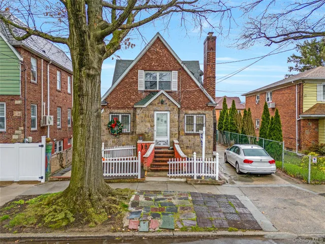 a front view of a residential apartment building with a yard