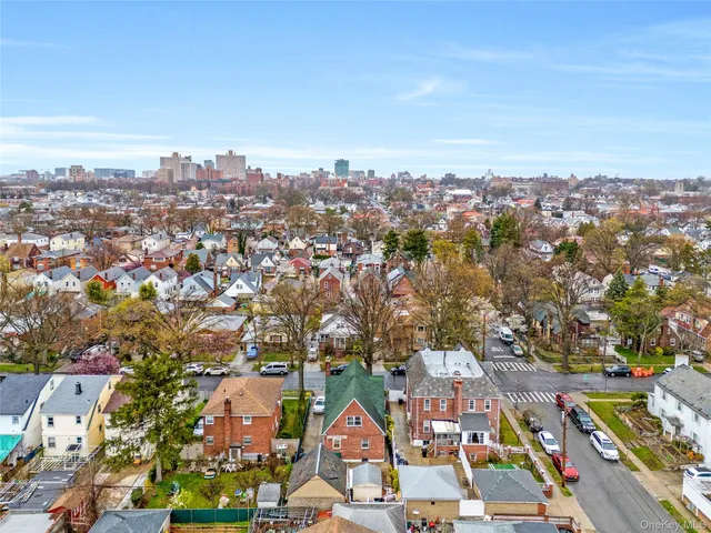 an aerial view of residential building with green space