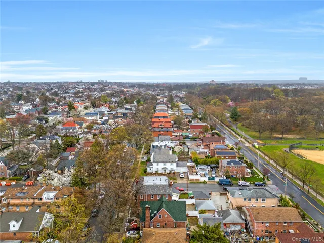 an aerial view of city and lake
