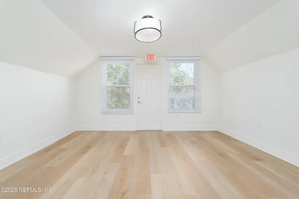 an empty room with large window