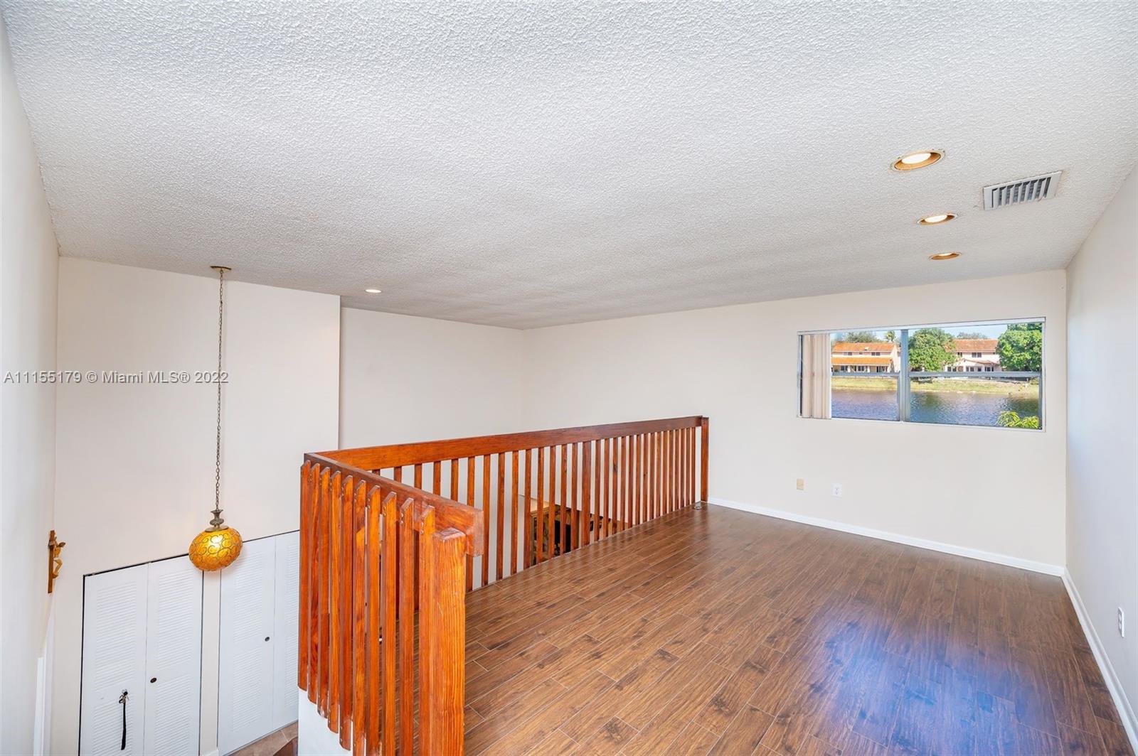 14853 Southwest 42nd Lane Miami, FL 33185 - Photo 20 of 28 a view of hallway with wooden floor