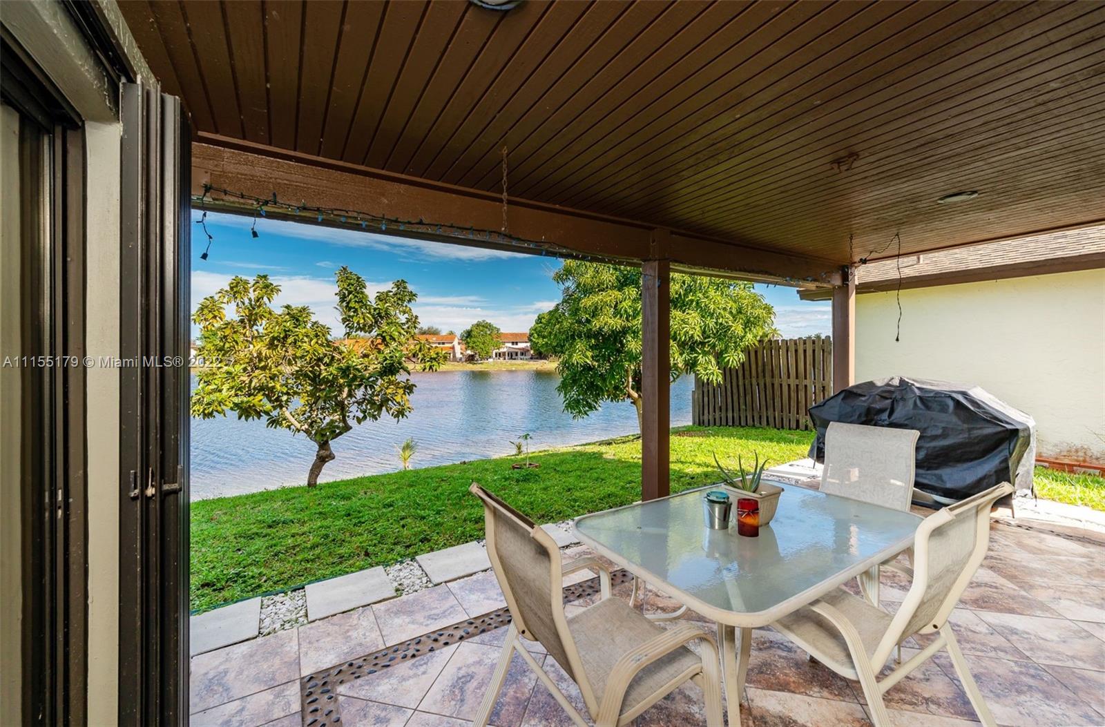 14853 Southwest 42nd Lane Miami, FL 33185 - Photo 4 of 28 a view of yard from deck with patio