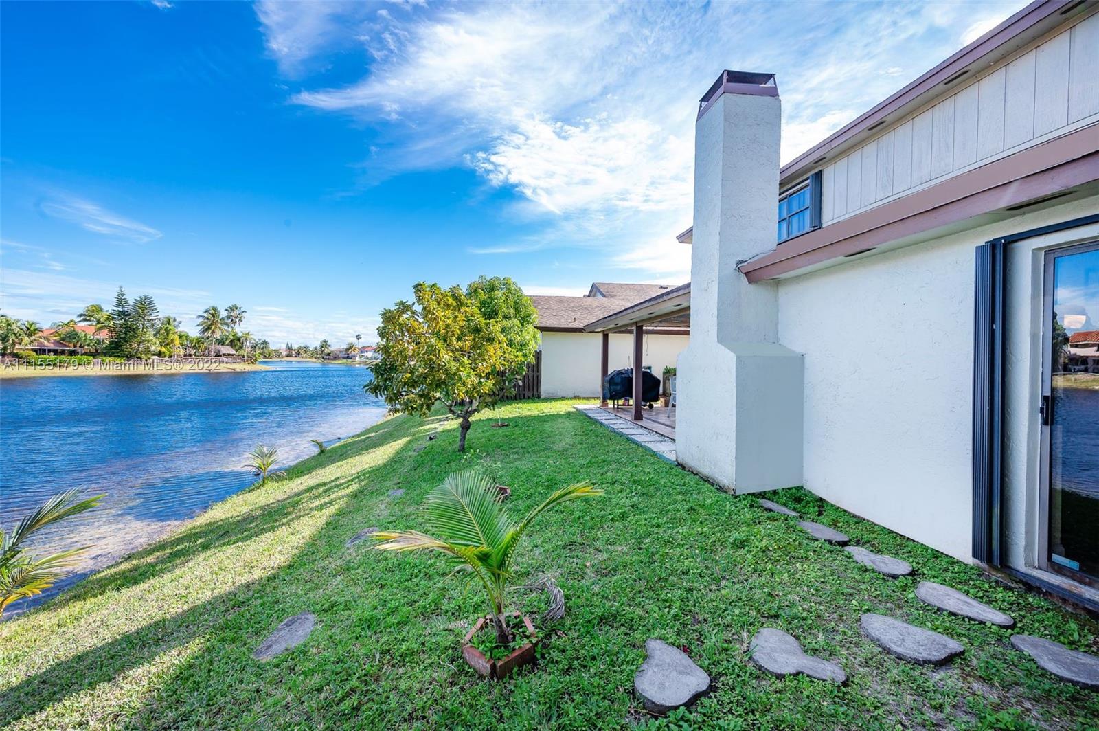 14853 Southwest 42nd Lane Miami, FL 33185 - Photo 6 of 28 a front view of a house with garden