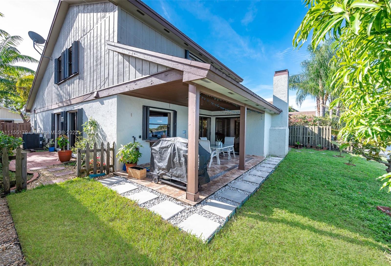 14853 Southwest 42nd Lane Miami, FL 33185 - Photo 9 of 28 a view of a house with backyard