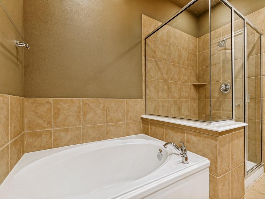 15741 Seabolt Place, Unit 28 Addison, TX 75001 - Photo 16 of 37 a bathroom with a bathtub and shower