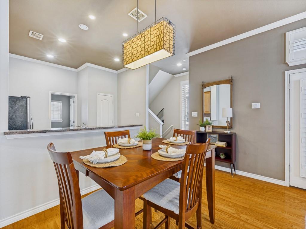 15741 Seabolt Place, Unit 28 Addison, TX 75001 - Photo 7 of 37 a dining room with furniture and wooden floor
