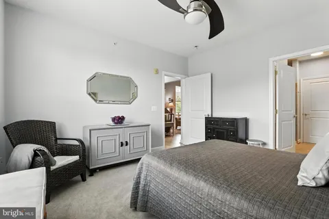 a bedroom with a bed and dresser