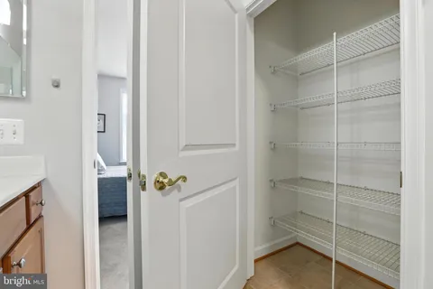 a bathroom with a walk in closet