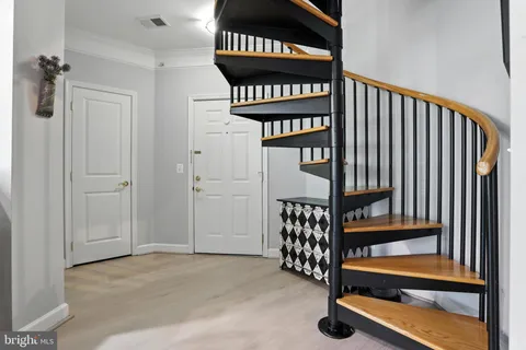 a view of front door with a stairs
