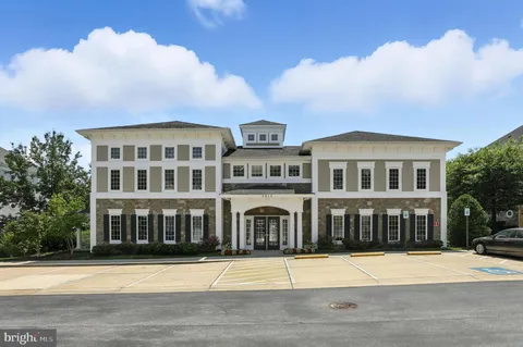 a view of a patio with a table and chairs and potted plants