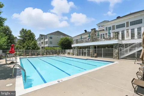 a room with furniture and a floor to ceiling window