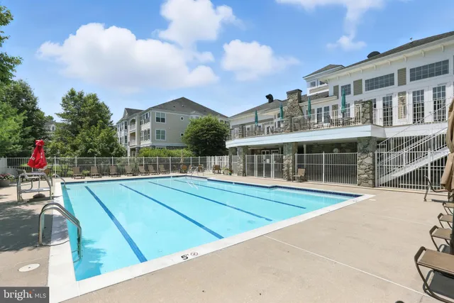 a room with furniture and a floor to ceiling window