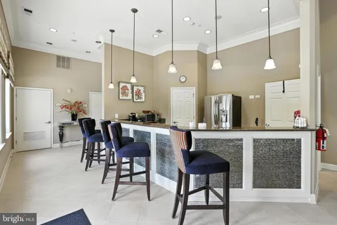 a living room with fireplace furniture and a large window