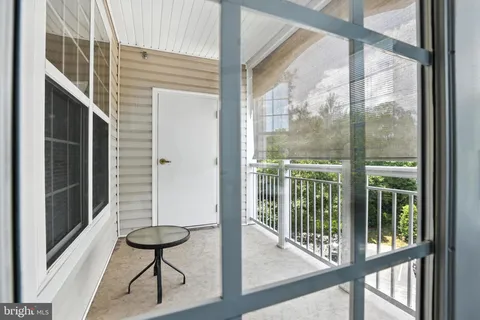 a view of a balcony with chairs