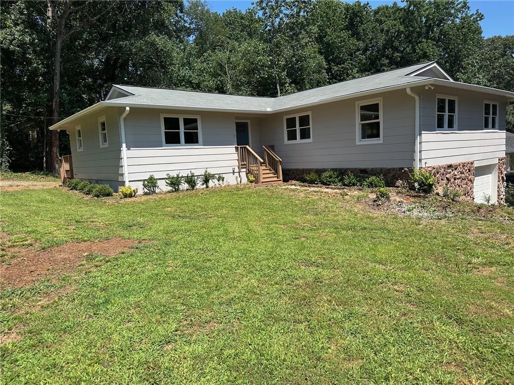 a front view of a house with yard