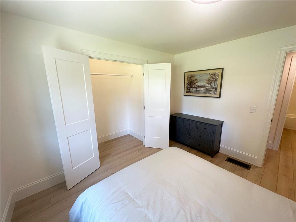 3405 Still Road Cumming, GA 30041 - Photo 14 of 28 a bedroom with a bed and wooden floor