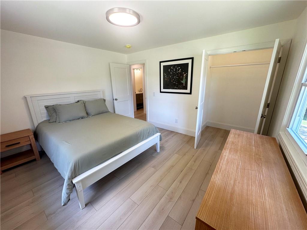 3405 Still Road Cumming, GA 30041 - Photo 15 of 28 a bedroom with a bed and wooden floor