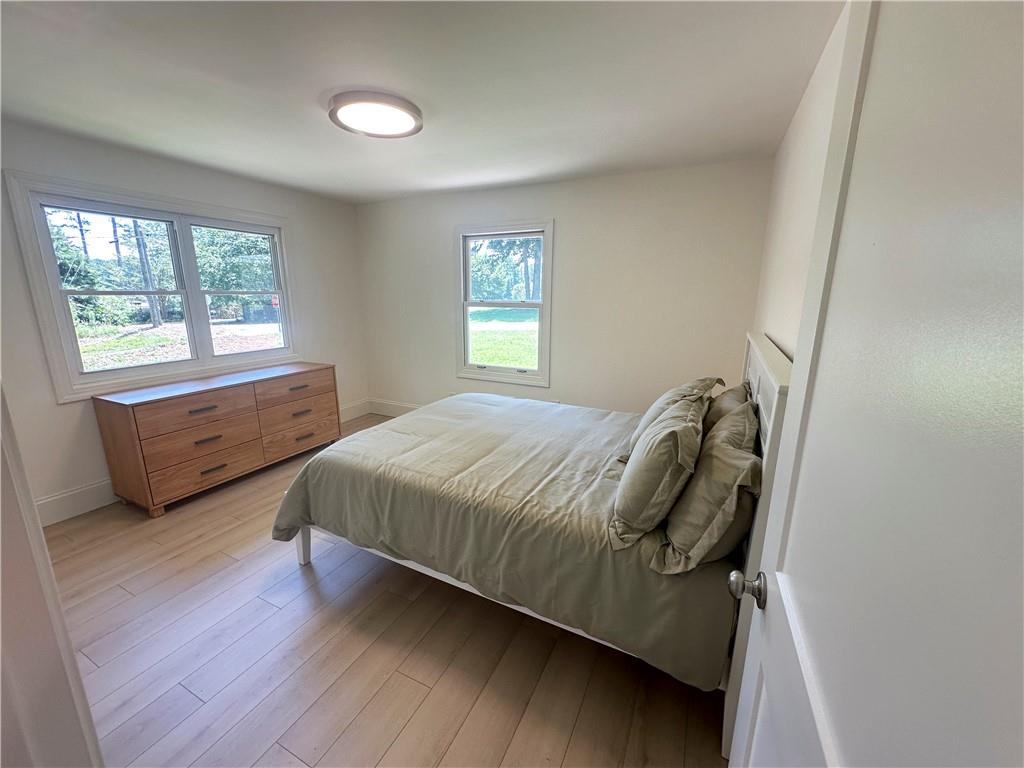 3405 Still Road Cumming, GA 30041 - Photo 16 of 28 a spacious bedroom with a bed and window