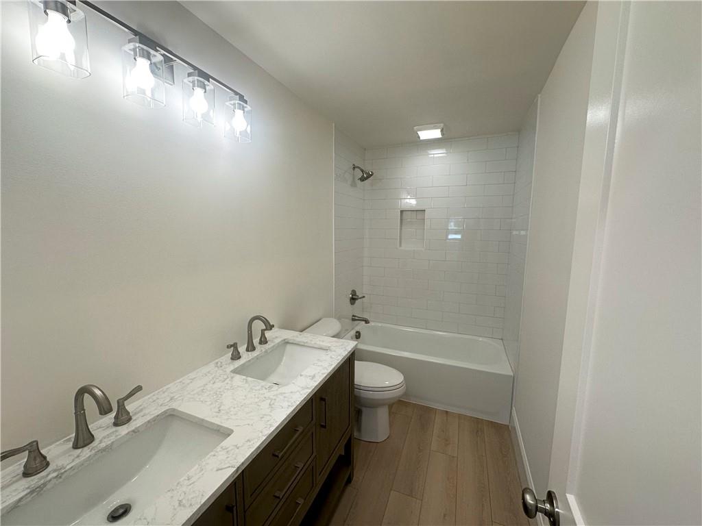 3405 Still Road Cumming, GA 30041 - Photo 19 of 28 a bathroom with a sink a toilet and shower
