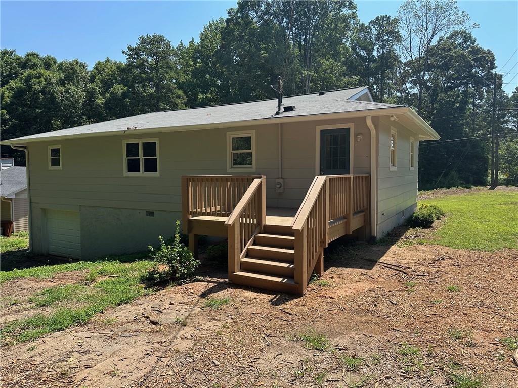 3405 Still Road Cumming, GA 30041 - Photo 21 of 28 a front view of a house with garden