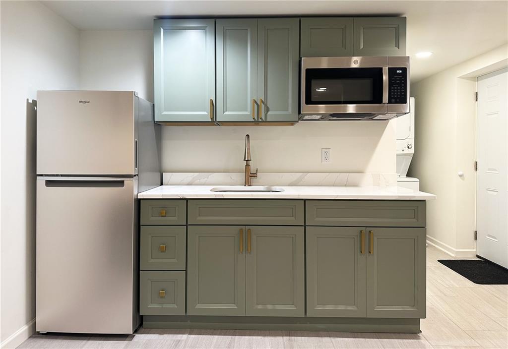 3405 Still Road Cumming, GA 30041 - Photo 27 of 28 a kitchen with a refrigerator and a microwave