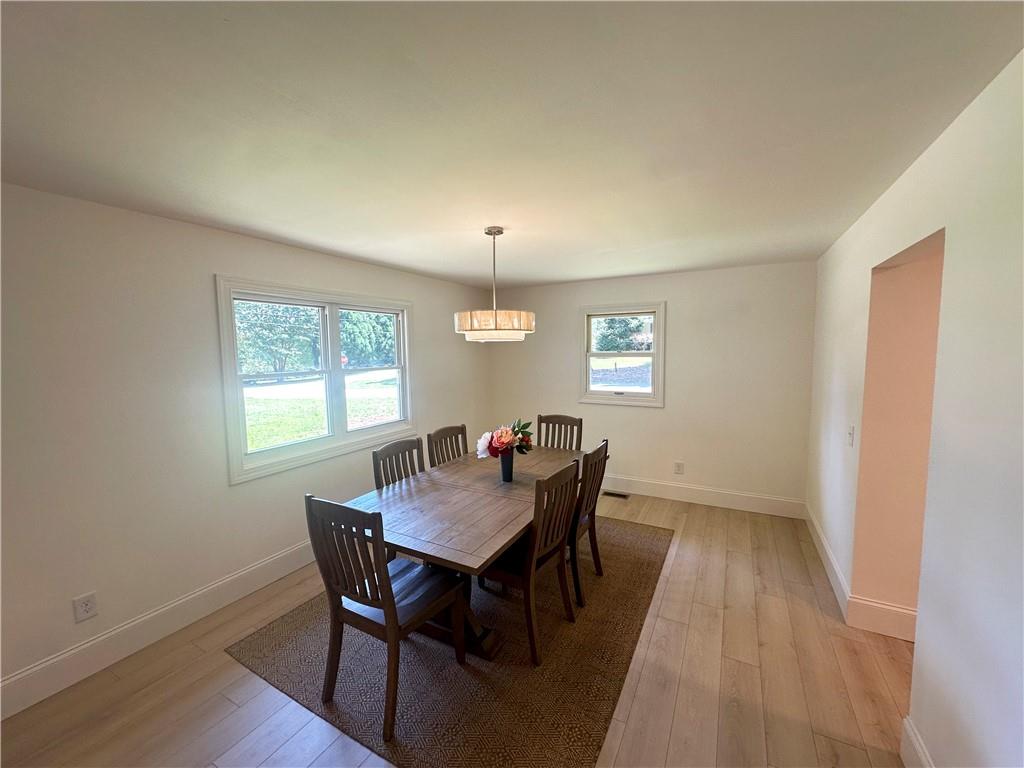 3405 Still Road Cumming, GA 30041 - Photo 3 of 28 a view of a dining room with furniture window and wooden floor