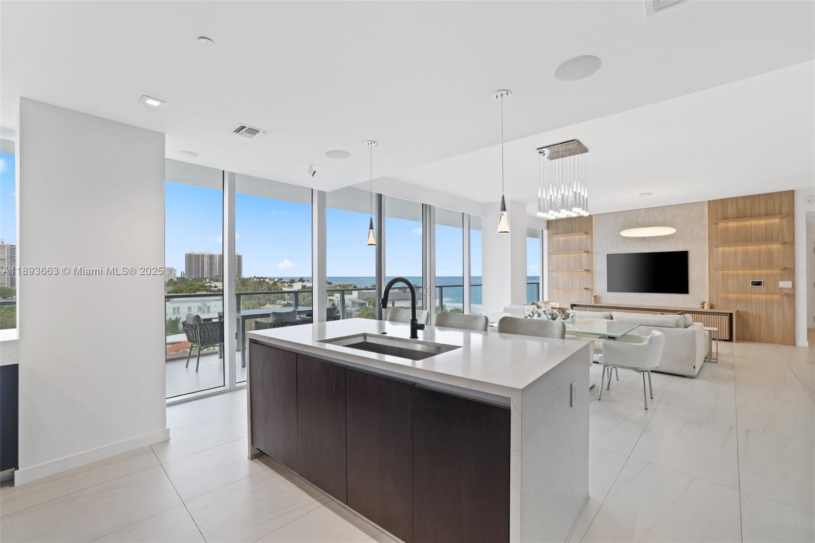 2200 North Ocean Boulevard, Unit N504 Fort Lauderdale, FL 33305 - Photo 1 of 43 a room with stainless steel appliances kitchen island granite countertop a sink and cabinets