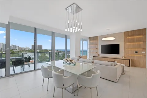 a view of a dining room with furniture wooden floor and chandelier