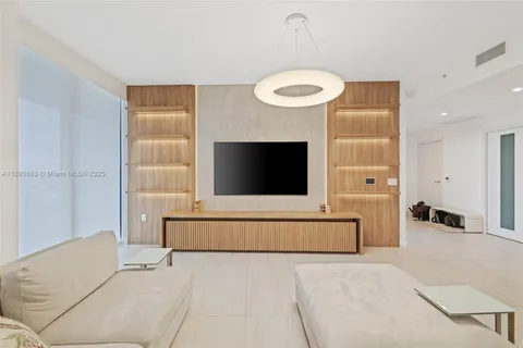 a living room with a couch and a fireplace