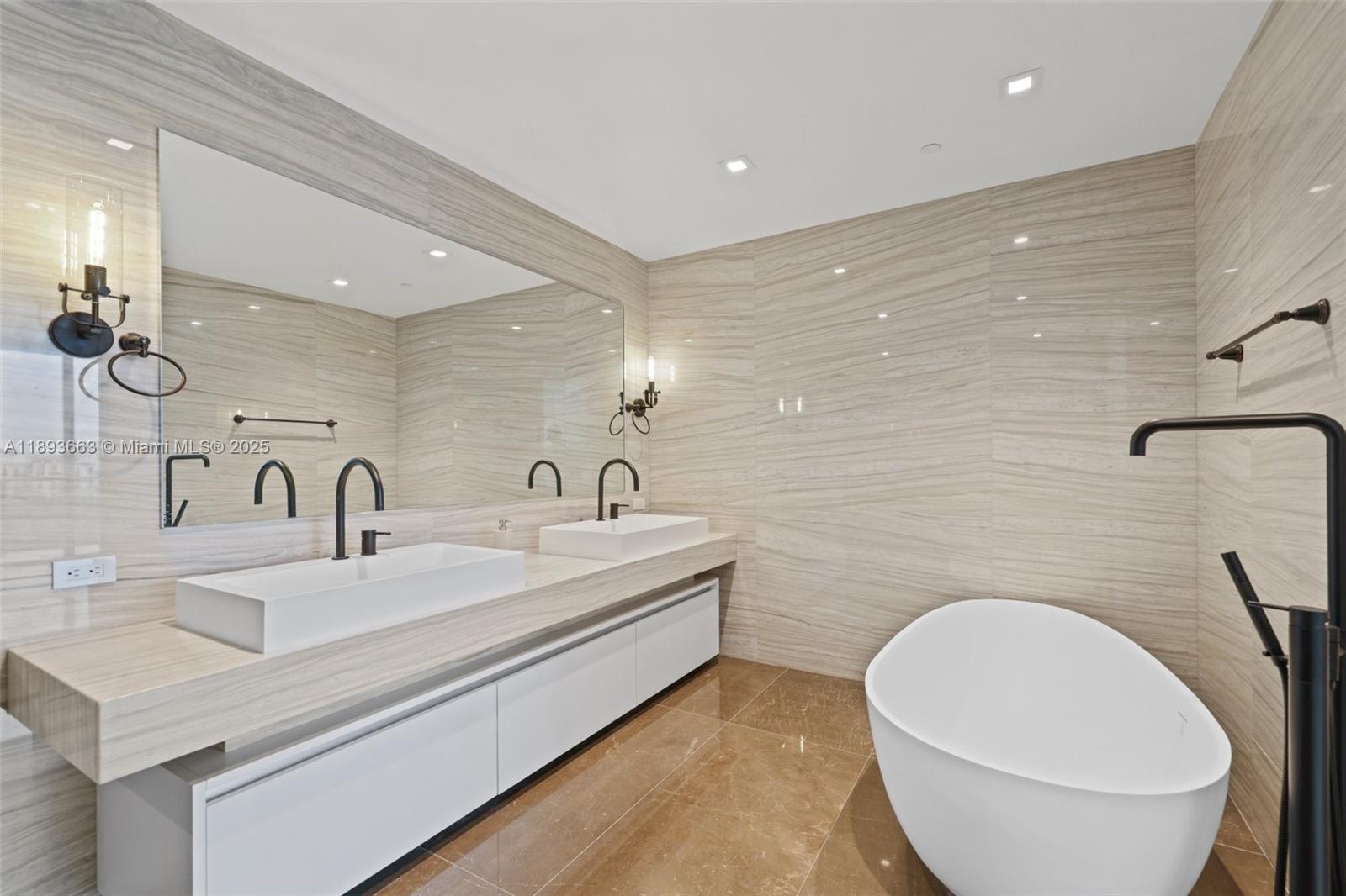 2200 North Ocean Boulevard, Unit N504 Fort Lauderdale, FL 33305 - Photo 15 of 43 a bathroom with a toilet sink and mirror