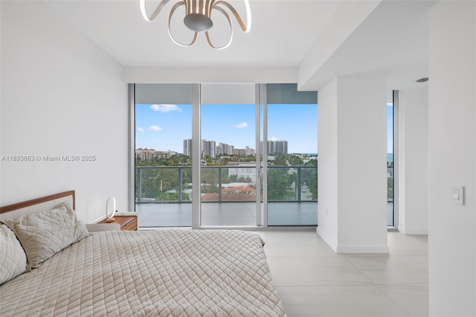 2200 North Ocean Boulevard, Unit N504 Fort Lauderdale, FL 33305 - Photo 19 of 43 a bedroom with furniture and a large window